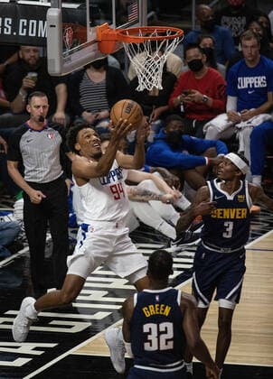 October 4, 2021, Los Angeles, California, USA: George King 94 of the Los Angeles Clippers goes for a reverse layup during their preseason NBA, Basketball Herren, USA game with the Denver Nuggets on Monday October 4, 2021 at the Staples Center in Los Angeles, California. Clippers defeat Nuggets, 103 - 102. PI Los Angeles USA - ZUMAp124 20211004_zaa_p124_019 Copyright: xJAVIERxROJASx