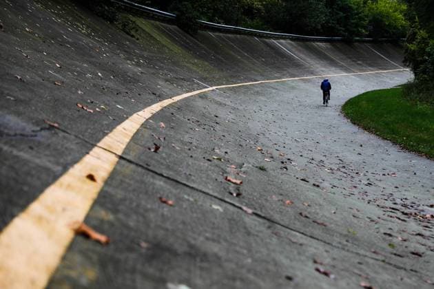 Monza Circuit A man rides a bike on the old oval section of the circuit in Monza, Italy on October 5, 2021. Monza Italy porzycki-monzacir211005_npmvZ  Copyright: xJakubxPorzyckix