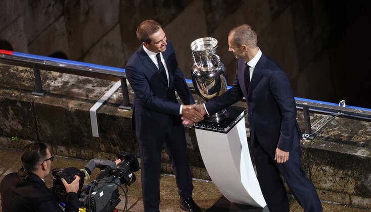 UEFA EURO 2024 Brand Launch BERLIN, GERMANY OCTOBER 05 Aleksander Ceferin R , UEFA President hands over the UEFA trophy to Philipp Lahm, Tournament Director of the Euro 2024 GmbH during the UEFA EURO 2024 Logo and Brand Launch at Olympiastadion on October 05, 2021 in Berlin, Germany Photo by Maja Hitij Getty Images Berlin Olympiastadion Berlin Germany Poolfoto Getty Images ,EDITORIAL USE ONLY