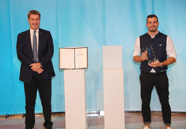 The Bavarian Prime Minister Dr Markus Söder awards the Bavarian Sports Award to the Bavarian medal winners from Tokyo Markus Söder and Sideris Tasiadis Munich Bavaria Germany State Chancellery Kuppelsaal