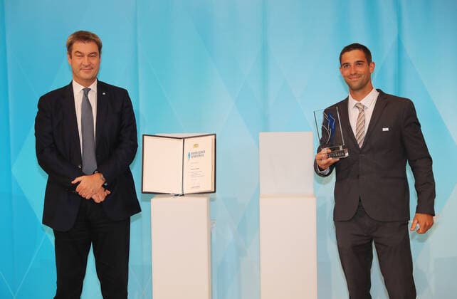 The Bavarian Prime Minister Dr Markus Söder awards the Bavarian Sports Award to the Bavarian medal winners from Tokyo Markus Söder and Hannes Aigner Munich Bavaria Germany State Chancellery Kuppelsaal
