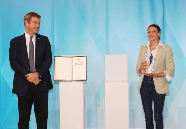 The Bavarian Prime Minister Dr Markus Söder awards the Bavarian Medalists of Tokyo the Bavarian Sports Award Markus Söder and Ricarda Funk Munich Bavaria Germany State Chancellery Kuppelsaal
