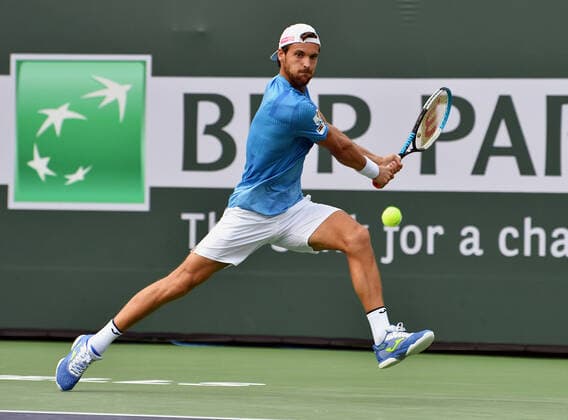 INDIAN WELLS, CA - OCTOBER 07: Joao Sousa of Portugal chases the ball during a tennis match played on October 7, 2021 at the BNP Paribas Open played at the Indian Wells Tennis Garden in Indian Wells, CA. (Photo by John Cordes Icon Sportswire) TENNIS: OCT 07 BNP Paribas Open Icon506211007824