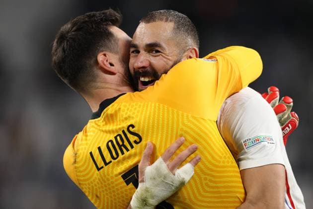 Turin, Italy, 7th October 2021. Karim Benzema of France celebrates with team mate Hugo Lloris following the final whistle of the UEFA Nations League match at Juventus Stadium, Turin. Picture credit should read: Jonathan Moscrop Sportimage EDITORIAL USE ONLY. No use with unauthorised audio, video, data, fixture lists, club league logos or live services. Online in-match use limited to 120 images, no video emulation. No use in betting, games or single club league player publications. SPI-1228-0152