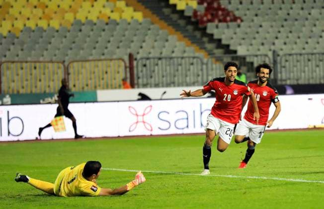 (211009) -- ALEXANDRIA, Oct. 9, 2021 -- Mohamed Salah (R) and Omar Marmoush (C) of Egypt celebrate during the FIFA 2022 World Cup qualifier match between Egypt and Libya in Alexandria, Egypt, on Oct. 8, 2021. (Photo by Xinhua) (SP)EGYPT-ALEXANDRIA-FOOTBALL-FIFA 2022 WORLD CUP QUALIFIERS-EGYPT VS LIBYA MohamedxAsad 