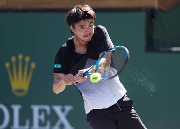 October 09, 2021 Taro Daniel of Japan returns a shot to Reilly Opelka at the 2021 BNP Paribas Open at Indian Wells Tennis Garden in Indian Wells, California. Mandatory Photo Credit : CSM Indian Wells United States of America - ZUMAc04_ 20211009_zaf_c04_098 Copyright: xCharlesxBausx