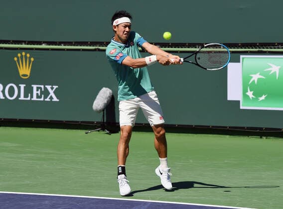 INDIAN WELLS, CA - OCTOBER 09: Kei Nishikori of Japan returns the ball in a tennis match during the BNP Paribas Open played on October 9, 2021 at the Indian Wells Tennis Garden in Indian Wells, CA. (Photo by John Cordes Icon Sportswire) TENNIS: OCT 09 BNP Paribas Open Icon506211009018