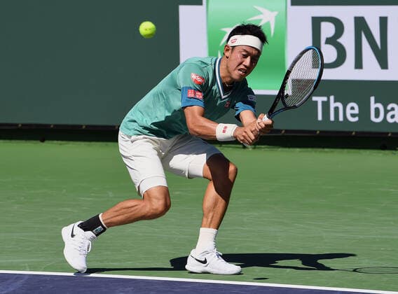 INDIAN WELLS, CA - OCTOBER 09: Kei Nishikori of Japan returns a shot during a tennis match during the BNP Paribas Open played on October 9, 2021 at the Indian Wells Tennis Garden in Indian Wells, CA. (Photo by John Cordes Icon Sportswire) TENNIS: OCT 09 BNP Paribas Open Icon506211009036