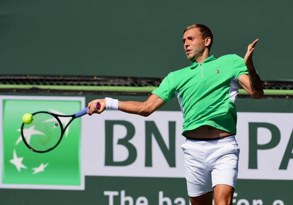 INDIAN WELLS, CA - OCTOBER 09: Daniel Evans of Great Britain returns the ball in a tennis match during the BNP Paribas Open played on October 9, 2021 at the Indian Wells Tennis Garden in Indian Wells, CA. (Photo by John Cordes Icon Sportswire) TENNIS: OCT 09 BNP Paribas Open Icon506211009040