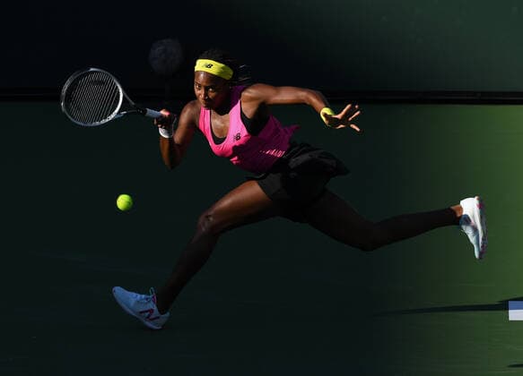 INDIAN WELLS, CA - OCTOBER 09: Cori Gauff of the United States chases after and returns the ball during a tennis match during the BNP Paribas Open played on October 9, 2021 at the Indian Wells Tennis Garden in Indian Wells, CA. (Photo by John Cordes Icon Sportswire) TENNIS: OCT 09 BNP Paribas Open Icon506211009080