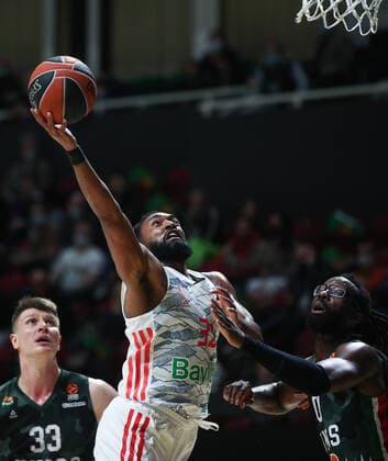 KAZAN, RUSSIA â€“ OCTOBER 12, 2021: Bayern Munich s Darrun Hilliard (C) and UNICS Kazan s Andrei Vorontsevich (L) and John Brown in a 2021-22 Euroleague Regular Season Round 3 basketball match between UNICS Kazan and Bayern Munich at Kazan Basket Hall. Yegor Aleyev TASS  TS113EEB