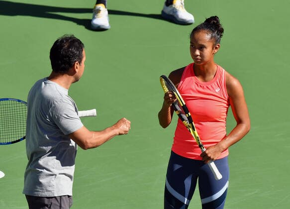 INDIAN WELLS, CA - OCTOBER 12: Leylah Fernandez of Canada talks with a member of her team during work outs on center court before the start of tournament play at the BNP Paribas Open on October 12, 2021 at the Indian Wells Tennis Garden in Indian Wells, CA. (Photo by John Cordes Icon Sportswire) TENNIS: OCT 12 BNP Paribas Open Icon506211012001