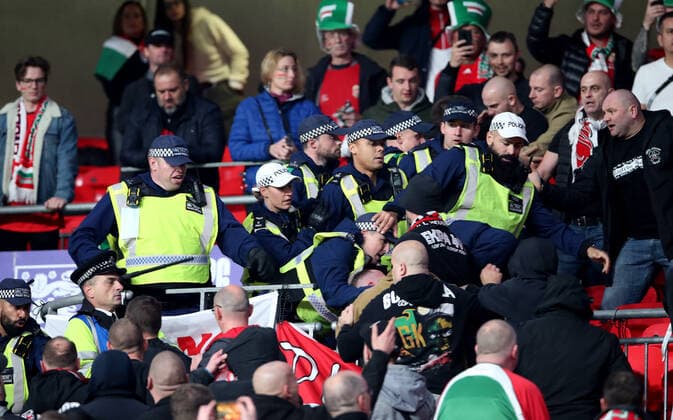 Mandatory Credit: Photo by Matt Impey Shutterstock (12534940t) Crowd trouble after Police move in to arrest a Hungary fan for racial aggravation and they fight back eventually resulting in the Policbacking away from the situation England v Hungary, Football, World Cup Qualifying, Group I, Wembley Stadium, Wembley, London, UK - 12 10 2021 Editorial use only England v Hungary, Football, World Cup Qualifying, Group I, Wembley Stadium, Wembley, London, UK - 12 10 2021 Editorial use only  Copyright: xMattxImpey Shutterstockx 12534940t