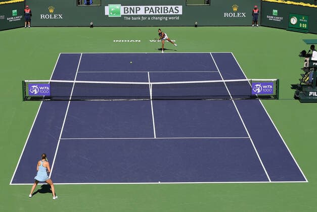 INDIAN WELLS, CA - OCTOBER 12: Leylah Fernandez of Canada serves to Shelby Rogers of the United States on court one during a tennis match played at the BNP Paribas Open on October 12, 2021 at the Indian Wells Tennis Garden in Indian Wells, CA. (Photo by John Cordes Icon Sportswire) TENNIS: OCT 12 BNP Paribas Open Icon506211012201