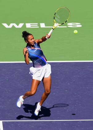 INDIAN WELLS, CA - OCTOBER 12: Leylah Fernandez of Canada chases after and returns the ball during a tennis match played at the BNP Paribas Open on October 12, 2021 at the Indian Wells Tennis Garden in Indian Wells, CA. (Photo by John Cordes Icon Sportswire) TENNIS: OCT 12 BNP Paribas Open Icon506211012202