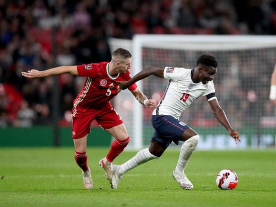 (211013) -- LONDON, Oct. 13, 2021 -- England s Bukayo Saka (R) is challenged by Hungary s Zsolt Nagy during the FIFA World Cup, WM, Weltmeisterschaft, Fussball Qatar 2022 qualification group I match between England and Hungary in London, Britain on Oct. 12, 2021. (Photo by Xinhua) (SP)BRITAIN-LONDON-FOOTBALL-WORLD CUP QUALIFYING-ENGLAND VS HUNGARY MatthewxImpey 