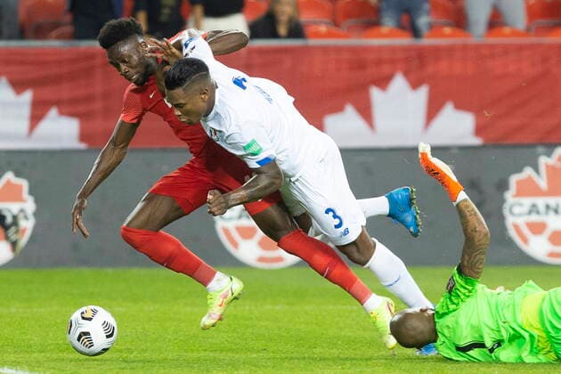 October 13, 2021, Toronto, on, Canada: Canada s Alphonso Davies (left) goes down under Harold Cummings challenge after rounding Panama goalkeeper Luis Mejia during first half World Cup qualifying action in Toronto, on Wednesday, October 13, 2021. Alphonso Davies; Harold Cummings; Luis Mejia  - ZUMAc35_ 20211013_zaf_c35_052 Copyright: xChrisxYoungx