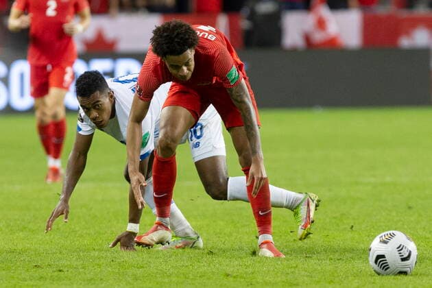 October 13, 2021, Toronto, on, Canada: Canada s Tajon Buchanan (right) is fouled by Panama s Edgar Barcenas during second half World Cup qualifying action in Toronto on Wednesday, October 13, 2021. Tajon Buchanan; Edgar Barcenas  - ZUMAc35_ 20211013_zaf_c35_070 Copyright: xChrisxYoungx