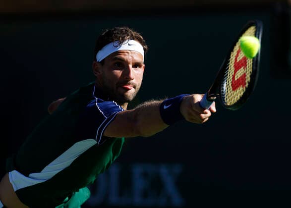 October 14, 2021 Grigor Dimitrov of Bulgaria returns a shot against Hubert Hurkacz of Poland during their quarterfinal match of the 2021 BNP Paribas Open at Indian Wells Tennis Garden in Indian Wells, California. Mandatory Photo Credit : CSM Indian Wells United States of America - ZUMAc04_ 20211014_zaf_c04_001 Copyright: xCharlesxBausx