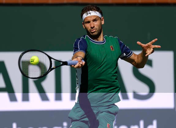 October 14, 2021 Grigor Dimitrov of Bulgaria returns a shot against Hubert Hurkacz of Poland during their quarterfinal match of the 2021 BNP Paribas Open at Indian Wells Tennis Garden in Indian Wells, California. Mandatory Photo Credit : CSM Indian Wells United States of America - ZUMAc04_ 20211014_zaf_c04_031 Copyright: xCharlesxBausx