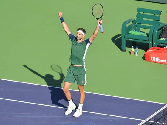 INDIAN WELLS, CA - OCTOBER 14: Gregor Dimitrov (BUL) raises his arms in celebration after winning his quarter final match during the BNP Paribas Open on October 14, 2021, at the Indian Wells Tennis Garden in Indian Wells, CA. (Photo by Cynthia Lum Icon Sportswire) TENNIS: OCT 14 BNP Paribas Open Icon250211014094