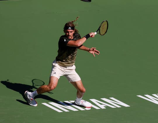 October 15, 2021 Stefanos Tsitsipas of Greece falls as he twists his ankle against Nikoloz Basilashvili of Georgia during their quarterfinal match of the 2021 BNP Paribas Open at Indian Wells Tennis Garden in Indian Wells, California. Mandatory Photo Credit : CSM Indian Wells United States of America - ZUMAc04_ 20211015_zaf_c04_067 Copyright: xCharlesxBausx