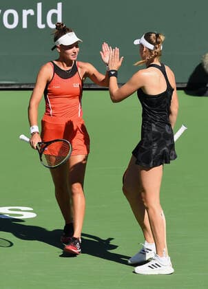 INDIAN WELLS, CA - OCTOBER 16: Veronika Kudermetova of Russia and Elena Rybakina of Kazakhstan high five on the court during a finals doubles tennis match played on October 16, 2021 at the BNP Paribas Open at the Indian Wells Tennis Garden in Indian Wells, CA. (Photo by John Cordes Icon Sportswire) TENNIS: OCT 16 BNP Paribas Open Icon506211016018