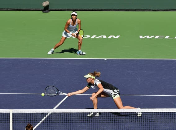INDIAN WELLS, CA - OCTOBER 16: Su-Wei Hsieh of Chinese Taipei watches her partner Elise Mertens of Belgium chase after a ball near the net during a finals doubles tennis match played on October 16, 2021 at the BNP Paribas Open at the Indian Wells Tennis Garden in Indian Wells, CA. (Photo by John Cordes Icon Sportswire) TENNIS: OCT 16 BNP Paribas Open Icon506211016036