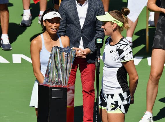 INDIAN WELLS, CA - OCTOBER 16: BNP Paribas Open doubles champions Su-Wei Hsieh of Chinese Taipei and Elise Mertens of Belgium pose for photographs with the championship trophy on center court after a doubles finals match played on October 16, 2021 at the Indian Wells Tennis Garden in Indian Wells, CA. (Photo by John Cordes Icon Sportswire) TENNIS: OCT 16 BNP Paribas Open Icon506211016042