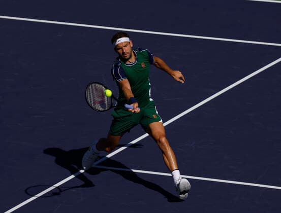 October 16, 2021 Grigor Dimitrov of Bulgaria returns a shot against Cameron Norrie of Great Britain in their semifinal match during the 2021 BNP Paribas Open at Indian Wells Tennis Garden in Indian Wells, California. Mandatory Photo Credit : CSM Indian Wells United States of America - ZUMAc04_ 20211016_zaf_c04_194 Copyright: xCharlesxBausx