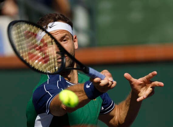 October 16, 2021 Grigor Dimitrov of Bulgaria returns a shot against Cameron Norrie of Great Britain in their semifinal match during the 2021 BNP Paribas Open at Indian Wells Tennis Garden in Indian Wells, California. Mandatory Photo Credit : CSM Indian Wells United States of America - ZUMAc04_ 20211016_zaf_c04_200 Copyright: xCharlesxBausx