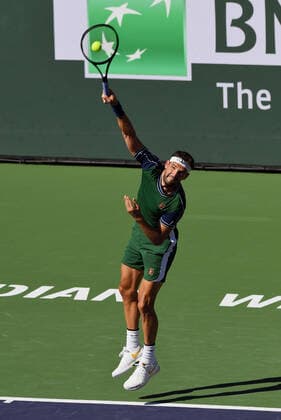 INDIAN WELLS, CA - OCTOBER 16: Grigor Dimitrov of Bulgaria serving during a semifinal tennis match played on October 16, 2021 at the BNP Paribas Open at the Indian Wells Tennis Garden in Indian Wells, CA. (Photo by John Cordes Icon Sportswire) TENNIS: OCT 16 BNP Paribas Open Icon506211016200