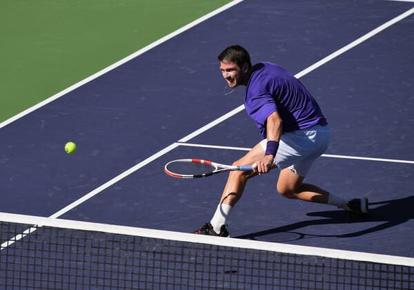 INDIAN WELLS, CA - OCTOBER 16: Cameron Norrie of Great Britain charges the net and returns the ball during a semifinal tennis match played on October 16, 2021 at the BNP Paribas Open at the Indian Wells Tennis Garden in Indian Wells, CA. (Photo by John Cordes Icon Sportswire) TENNIS: OCT 16 BNP Paribas Open Icon506211016207