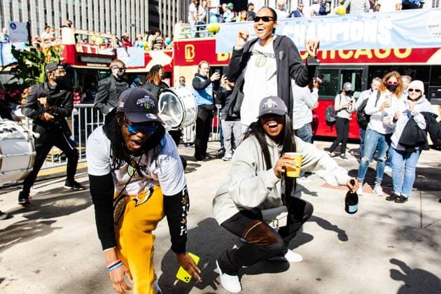 The Loop Chicago Sky Players Diamon DeShields, Lexie Brown and Azure Stevens celebrate after coming off of the bus during the Chicago Sky Championship Parade and Rally on October 19, 2021 at the Pritzker Pavilion Shaina Benhiyoun SPP Chicago Sky 2021 Championship Parade and Rally 