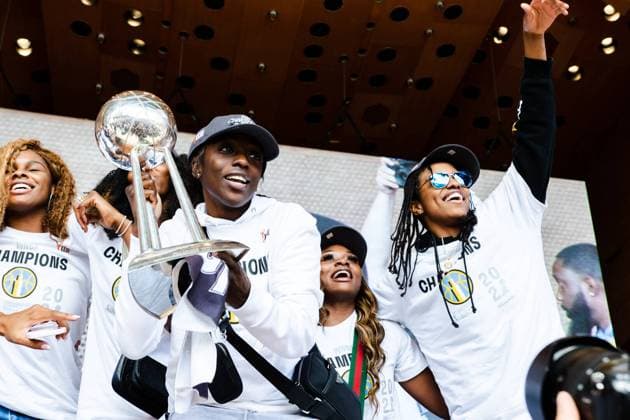 The Loop Chicago Sky player Kahleah Copper and teammates pose with the trophy during the Chicago Sky Championship Parade and Rally on October 19, 2021 at the Pritzker Pavilion Shaina Benhiyoun SPP Chicago Sky 2021 Championship Parade and Rally 