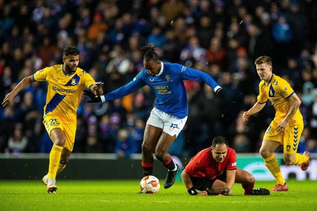 Mandatory Credit: Photo by Kirk O Rourke Rangers FC Shutterstock (12547535do) Referee Fran Jovic falls as Joe Aribo of Rangers gets away from Morten Frendrup of Brondby during the Europa League match at Ibrox Stadium, Glasgow. Rangers v Brondby, UEFA Europa League, Group A, Football, Ibrox Stadium, Glasgow, UK - 21 Oct 2021 EDITORIAL USE ONLY No use with unauthorised audio, video, data, fixture lists, club league logos or live services. Online in-match use limited to 120 images, no video emulation. No use in betting, games or single club league player publications. Rangers v Brondby, UEFA Europa League, Group A, Football, Ibrox Stadium, Glasgow, UK - 21 Oct 2021 EDITORIAL USE ONLY No use with unauthorised audio, video, data, fixture lists, club league logos or live services. Online in-match use limited to 120 images, no video emulation. No use in betting, games or single club league player publications. Copyright: xKirkxO Rourke RangersxFC Shutterstockx 12547535do