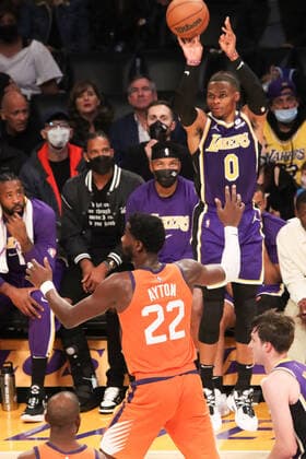 October 22, 2021, Los Angeles, California, USA: Lakers Russell Westbrook puts up this jumper over Suns defender Deandre Ayton during the contest as the host Los Angeles Lakers fall to the visiting Phoenix Suns 105-115 on Friday, October 22, 2021 at The Staples Center in Los Angeles, California. PI Los Angeles USA - ZUMAp124 20211022_zaa_p124_033 Copyright: xBURTxHARRISx