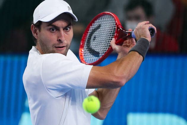 MOSCOW, RUSSIA - OCTOBER 23, 2021: Russia s Aslan Karatsev returns the ball in his men s singles semifinal match against Russia s Karen Khachanov at the VTB Kremlin Cup 2021 international tennis tournament at the Irina Viner-Usmanova Gymnastics Palace. Mikhail Tereshchenko TASS  TS115633
