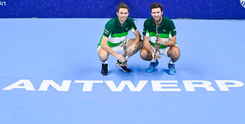 French Nicolas Mahut and French Fabrice Martin pictured with the trophy after winning a doubles men game between Dutch pair Koolhof - Rojer and French Mahut - Martin, the finals of the European Open Tennis ATP, Tennis Herren tournament, in Antwerp, Sunday 24 October 2021. LAURIExDIEFFEMBACQ  x3122819x