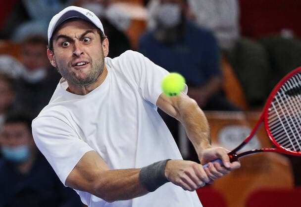 MOSCOW, RUSSIA - OCTOBER 24, 2021: Russia s Aslan Karatsev returns the ball in his singles final match against Croatia s Marin Cilic at the VTB Kremlin Cup 2021 international tennis tournament at the Irina Viner-Usmanova Gymnastics Palace. Mikhail Tereshchenko TASS  TS11583F