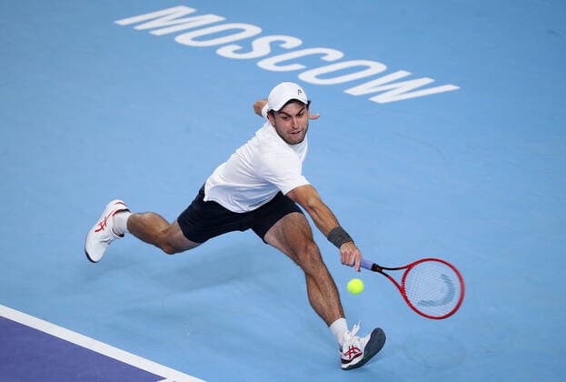 MOSCOW, RUSSIA - OCTOBER 24, 2021: Russia s Aslan Karatsev returns the ball in his singles final match against Croatia s Marin Cilic at the VTB Kremlin Cup 2021 international tennis tournament at the Irina Viner-Usmanova Gymnastics Palace. Mikhail Tereshchenko TASS  TS115879