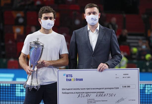 MOSCOW, RUSSIA - OCTOBER 24, 2021: Russia s Aslan Karatsev (L) celebrates winning the first prize of the VTB Kremlin Cup 2021 international tennis tournament during the victory ceremony at the Irina Viner-Usmanova Gymnastics Palace. Mikhail Tereshchenko TASS  TS1158A5