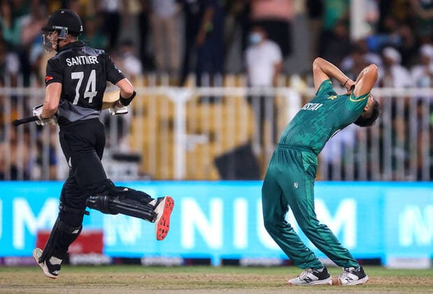 26th October 2021: Sharjah , UAE; Pakistan& x2019;s Haris Rauf (R) reacts after Mitchell Santner from the New Zealand BlackCaps hit a boundary during the ICC Men s T20 World Cup 2021 between the New Zealand BlackCaps and Pakistan at Sharjah Cricket Stadium  ActionPlus12334285 DavidxGray