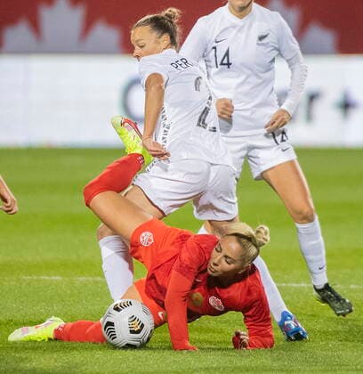 October 26, 2021, Montreal, PQ, Canada: Canada™s Adriana Leon is upended by New Zealand™s Ria Percival (2) during first half Celebration Tour soccer action in Montreal, Tuesday, October 26, 2021. Ria Percival, Adriana Leon,  - ZUMAc35_ 20211026_zaf_c35_318 Copyright: xGrahamxHughesx