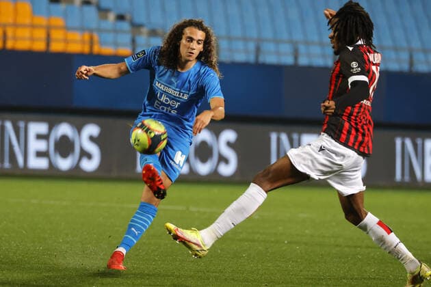 (211028) -- TROYES, Oct. 28, 2021 -- Thuram-Ulien (R) of OGC Nice vies with Matteo Guendouzi of Olympique de Marseille during the Ligue 1 match between OGC Nice and Olympique de Marseille in Troyes, France, on Oct. 27, 2021. (Photo by Xinhua) (SP)FRANCE-TROYES-FOOTBALL-NICE VS MARSILLE JackxChan 