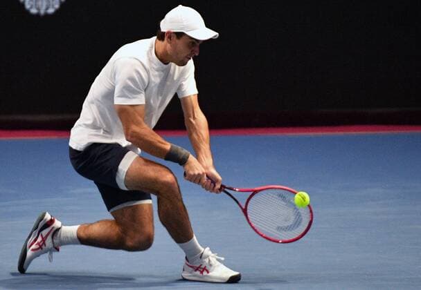 6683410 28.10.2021 Russia s Aslan Karatsev returns the ball during the men s singles 2nd round tennis match against Australia s John Millman at the St. Petersburg Open international tournament at Sibur Arena, in St. Petersburg, Japan. Alexander Galperin Sputnik Russia Tennis St Petersburg Open  b09c6e0a26f24e96