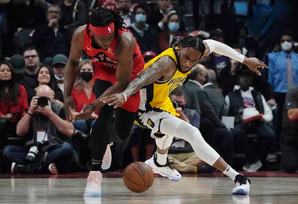 October 27, 2021, TORONTO, ON, CANADA: Toronto Raptors forward Precious Achiuwa (5) and Indiana Pacers forward Oshae Brissett (12) battle for the ball during first half NBA, Basketball Herren, USA basketball action in Toronto on Wednesday, October 27, 2021. Canada News - October 27, 2021  - ZUMAc35_ 20211027_zaf_c35_078 Copyright: xNathanxDenettex