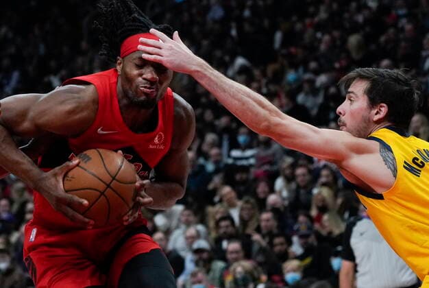 October 27, 2021, TORONTO, ON, CANADA: Toronto Raptors forward Precious Achiuwa (5) gets fouled by Indiana Pacers guard T.J. McConnell (9) during first half NBA, Basketball Herren, USA basketball action in Toronto on Wednesday, October 27, 2021. Canada News - October 27, 2021  - ZUMAc35_ 20211027_zaf_c35_095 Copyright: xNathanxDenettex