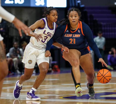 October 30, 2021: Langston s Richelle Turney (21) tries the drive the ball past LSU s Khayla Pointer (3) during NCAA, College League, USA Women s Basketball action between the Langston Lions and the LSU Tigers at the Pete Maravich Assembly Center in Baton Rouge, LA. CSM Baton Rouge USA - ZUMAc04_ 20211030_zaf_c04_440 Copyright: xJonathanxMailhesx