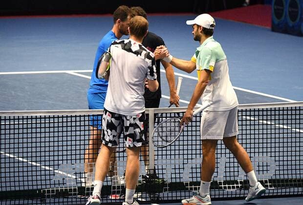 6686031 31.10.2021 Britian s Jamie Murray, Brazil s Bruno Soares, from left in the background, Kazakhstan s Andrey Golubev and Monaco s Hugo Nys shake hands after the men s doubles final match at the St. Petersburg Open international tennis tournament in St. Petersburg, Russia. Alexander Galperin Sputnik Russia Tennis St Petersburg Open  df4d09aac03718a1